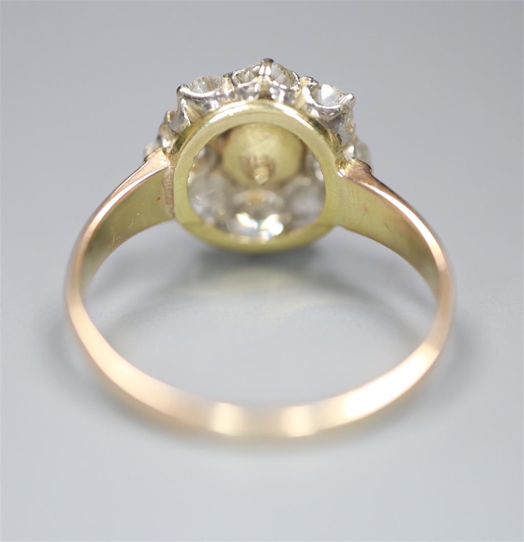 A yellow metal, cultured pearl and diamond set flower head cluster ring, size L, gross 3.1 grams,